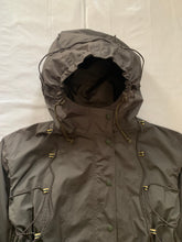 Load image into Gallery viewer, ss2004 Issey Miyake Military Khaki Bungee Cord Long Raincoat - Size M