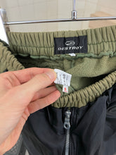 Load image into Gallery viewer, 1990s Vintage Destroy Olive Two-Tone Nylon Cotton Sweatpants - Size L